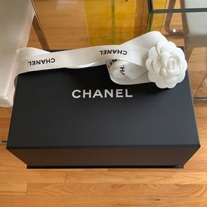 Small Chanel bag box, ribbon with camellia, and tissue paper